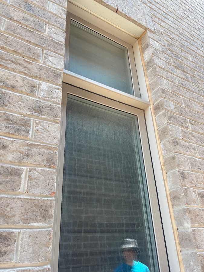 Tall window hazy before cleaning